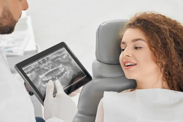 orthodontists showing patient an xray